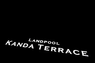 a sign that reads landrook karma terrace in a black background at bnb+ Kanda Terrace Ogawamachi in Tokyo