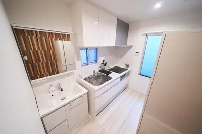 a white bathroom with a sink and a mirror at FINOA Residential Suite IKEBUKURO - 5BR Large Vacation Home in Tokyo