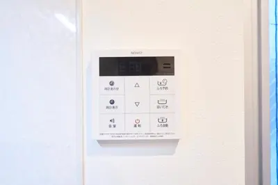 an electronic device is attached to a wall at FINOA Residential Suite IKEBUKURO - 5BR Large Vacation Home in Tokyo