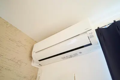 a microwave oven in a room with a wall at FINOA Residential Suite IKEBUKURO - 5BR Large Vacation Home in Tokyo
