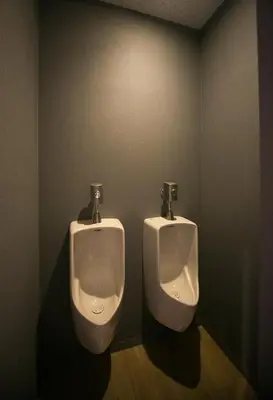 a bathroom with two urinals in a room at THE WARDROBE Hotel Shimokitazawa in Tokyo