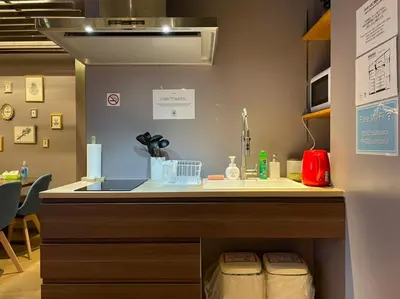 a kitchen with a sink and a counter top at THE WARDROBE Hotel Shimokitazawa in Tokyo