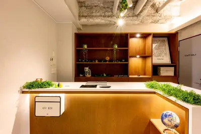 a kitchen with a counter with plants on it at plat hostel keikyu minowa forest in Tokyo