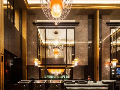 a dining room with chandeliers and tables in a building at APA Hotel PRIDE Akasaka Kokkaigijidomae in Tokyo