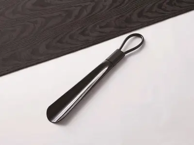 a black plastic spatula sitting on top of a table at APA Hotel PRIDE Akasaka Kokkaigijidomae in Tokyo