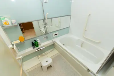 a bathroom with a tub and a sink and a toilet at Matsui Building in Tokyo