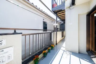 a balcony of a building with flowers on it at \u6771\u4eac\u82b3\u534e\u9a7f\u7ad9 in Tokyo