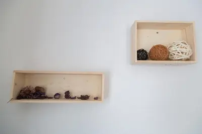 a white wall with two shelves with balls of yarn at Cozy Vibes Apt Hotel in Tokyo