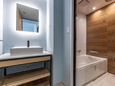 a bathroom with a sink and a bath tub at Tokyu Stay Shibuya Shin-Minamiguchi in Tokyo