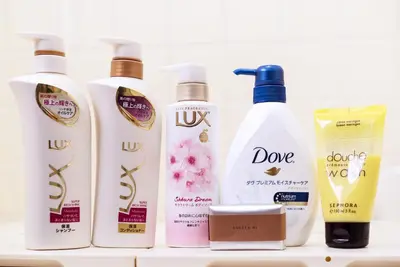 a group of four bottles of hair products on a shelf at Murata Corpo 305 in Tokyo