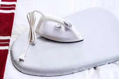 a white telephone sitting on top of a table at Murata Corpo 305 in Tokyo