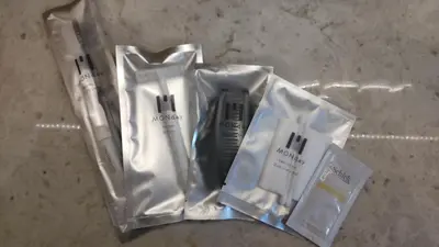 a group of toothbrushes and toothpaste in plastic bags at hotel MONday Tokyo Nishikasai in Tokyo
