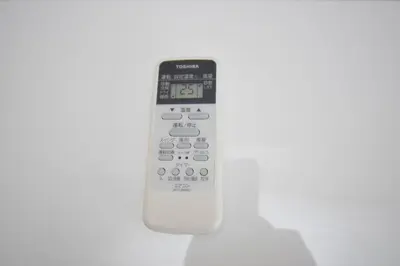 a remote control sitting on top of a table at Square Shibuya 909 in Tokyo