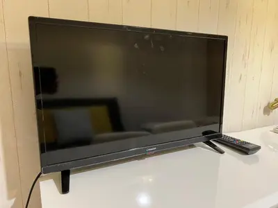 a flat screen tv sitting on top of a table at Square Shibuya 909 in Tokyo