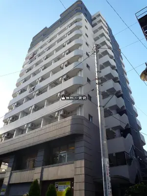 a tall building with a street sign in front of it at Square Shibuya 909 in Tokyo