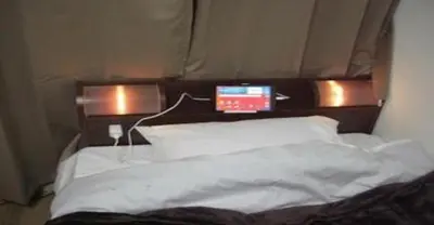 a bed with two lights on top of it at 2-10-15 Imagawa - Apartment / Vacation STAY 7907 in Tokyo
