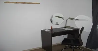 a black desk with a mirror and a chair at 2-10-15 Imagawa - Apartment / Vacation STAY 7907 in Tokyo