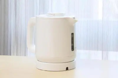 a white coffee maker sitting on a table at Keisei Richmond Hotel Tokyo Monzennakacho in Tokyo