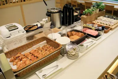 a buffet with many different types of food on a counter at Keisei Richmond Hotel Tokyo Monzennakacho in Tokyo