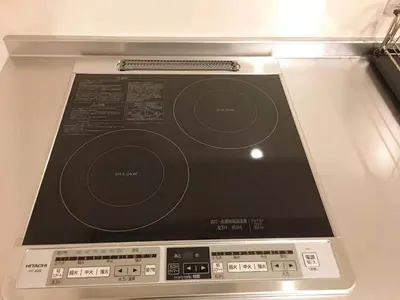 a laptop computer sitting on top of a table at Asakusa Kei House in Tokyo