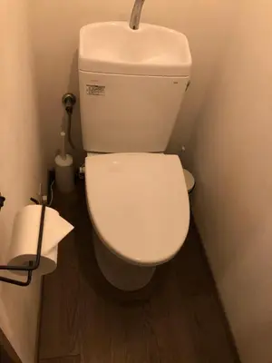 a bathroom with a white toilet with a sink at Shimokitazawa Private House in Tokyo