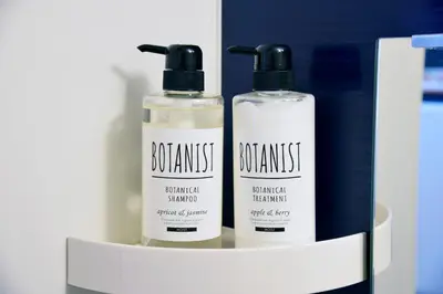 two bottles of disinfectants are sitting on a shelf at Roppongi Japan House602 in Tokyo