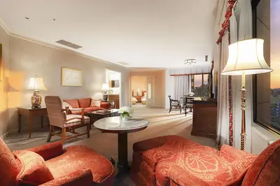 a living room with a couch and a table at Hotel Chinzanso Tokyo in Tokyo