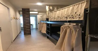 a room with a row of racks of shirts at 3-25-2 Higashiogu - Apartment / Vacation STAY 8340 in Tokyo