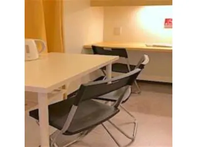 a white table and two chairs in a room at 3-25-2 Higashiogu - Apartment / Vacation STAY 8340 in Tokyo