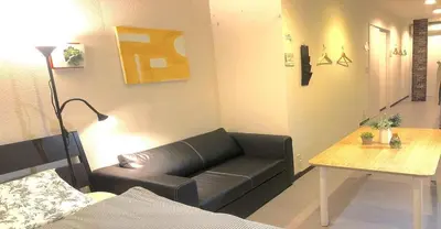a living room with a couch and a table at 3-25-2 Higashiogu - Apartment / Vacation STAY 8340 in Tokyo