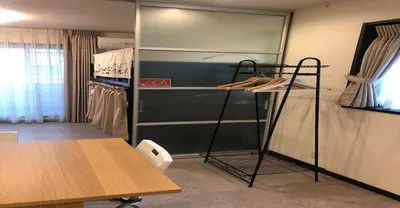 a room with a closet with shelves and a table at 3-25-2 Higashiogu - Apartment / Vacation STAY 8342 in Tokyo