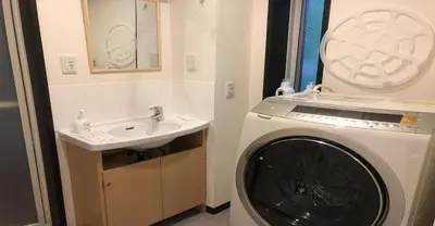 a bathroom with a washing machine and a sink at 3-25-2 Higashiogu - Apartment / Vacation STAY 8342 in Tokyo