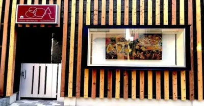 a picture in a window on a striped building at 3-25-2 Higashiogu - Apartment / Vacation STAY 8342 in Tokyo