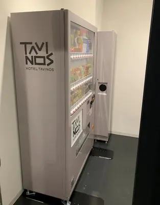 a gray refrigerator with a sign on the side of it at HOTEL TAVINOS Hamamatsucho in Tokyo