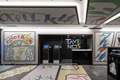a room with many graffiti on the walls at HOTEL TAVINOS Hamamatsucho in Tokyo