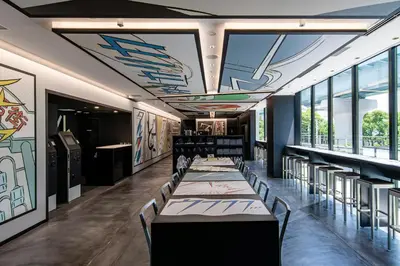 a dining room with tables and chairs and windows at HOTEL TAVINOS Hamamatsucho in Tokyo