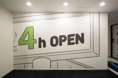a wall with the open sign on it at HOTEL TAVINOS Hamamatsucho in Tokyo