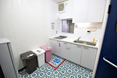 a small white kitchen with a sink and a counter at IROHA Residential Suite Asakusa Skytree in Tokyo