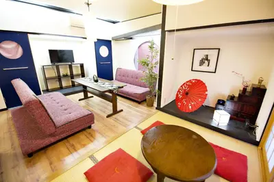 a living room with a couch and a table at IROHA Residential Suite Asakusa Skytree in Tokyo