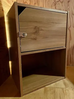 a wooden cupboard with a drawer in a room at Nomad Hostel Classic in Tokyo