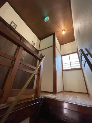 an empty room with a staircase and a window at Nomad Hostel Classic in Tokyo