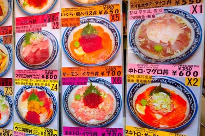 a bunch of plates of food on a wall at bnb+ Ueno Okachimachi in Tokyo