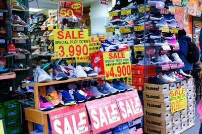 a display of shoes on display in a store at bnb+ Ueno Okachimachi in Tokyo