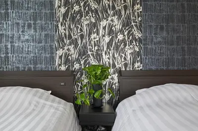 a bedroom with two beds and a plant on a table at G48-Superior Room in Shinjuku, Tokyo in Tokyo