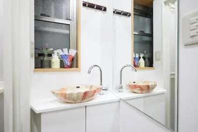 two sinks in a bathroom with white cabinets at G48-Superior Room in Shinjuku, Tokyo in Tokyo