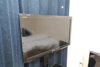 a microwave oven sitting on top of a curtain at IBASHO ShibuyaDogenzaka810 in Tokyo