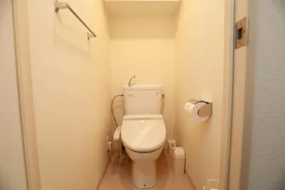 a bathroom with a toilet in a small room at IBASHO ShibuyaDogenzaka907 in Tokyo
