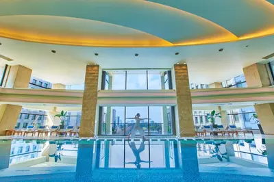 a large building with a pool in the middle at The Peninsula Tokyo in Tokyo