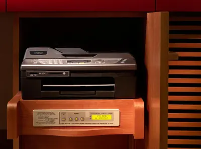 an electronic device sitting on top of a dvd player at The Peninsula Tokyo in Tokyo