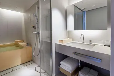 a bathroom with a shower and a sink at TSUKI Tokyo in Tokyo